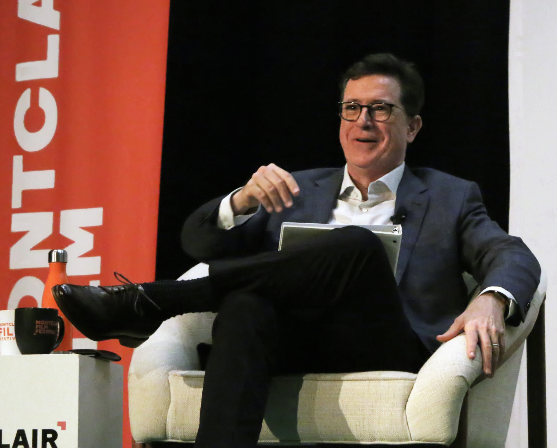 Stephen Colbert At The Montclair Film Festival. Stephen Colbert in conversation with actress Rachel Weisz on her new movie, Disobedience The event took place in Buzz Aldrin middle school, during The Montclair Film Festival in Montclair, NJ.