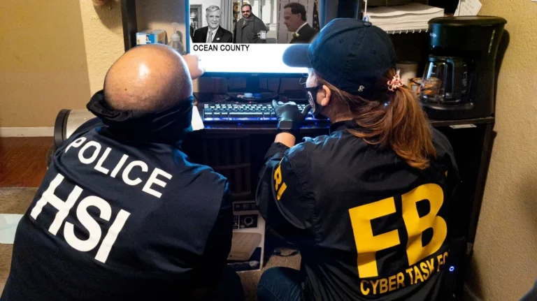 Man crashes car into fbi gate throws flag in bizarre attack - photo licensed by shore news network.