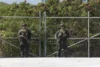 U. S. Marines guarding a temporary migrant holding facility.
