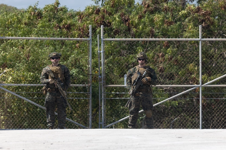 U.S. Marines guarding a temporary migrant holding facility.