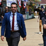 NJ Attorney General being escorted on the Seaside Heights Police Department with Ocean County Commissioner Robert Arace.