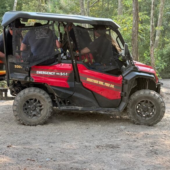 Fire crews use off-road unit to rescue unconscious victim in remote wooded area - photo licensed by shore news network.