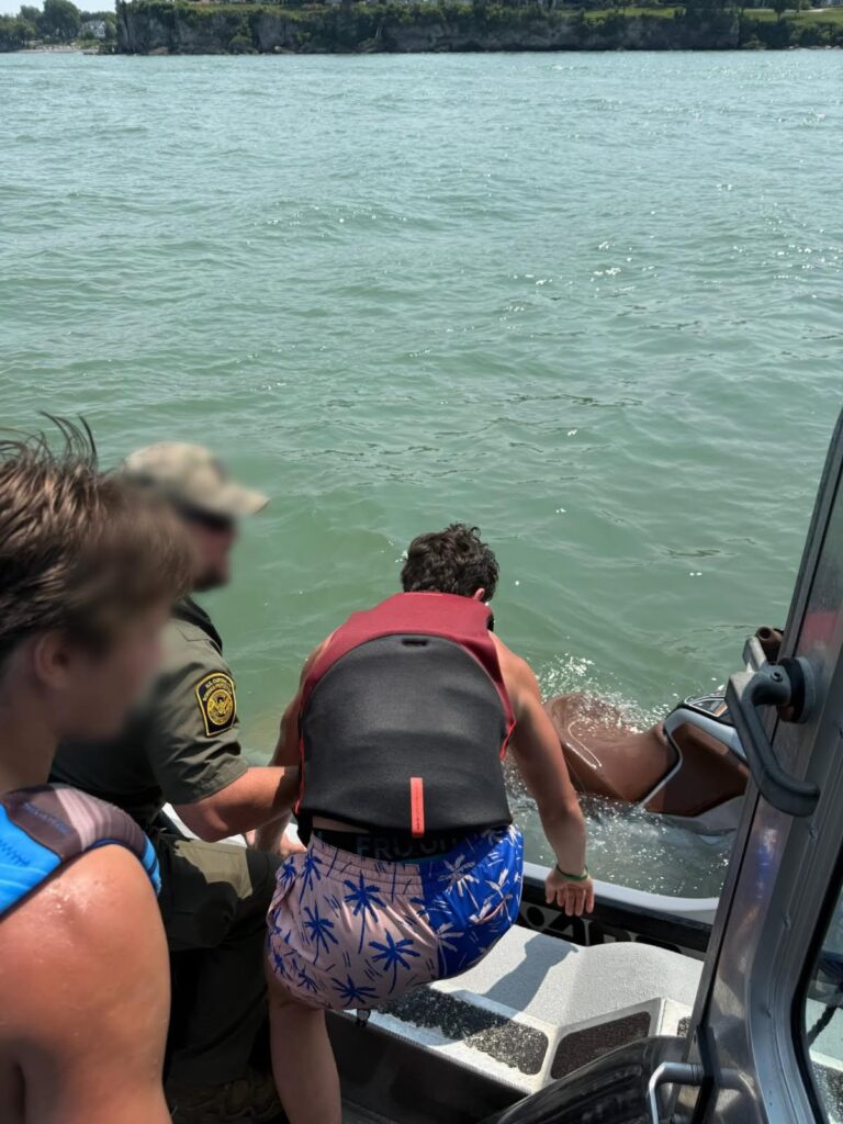 Border patrol agents rescue teens from sinking jet ski as ferries close in on lake erie - photo licensed by shore news network.