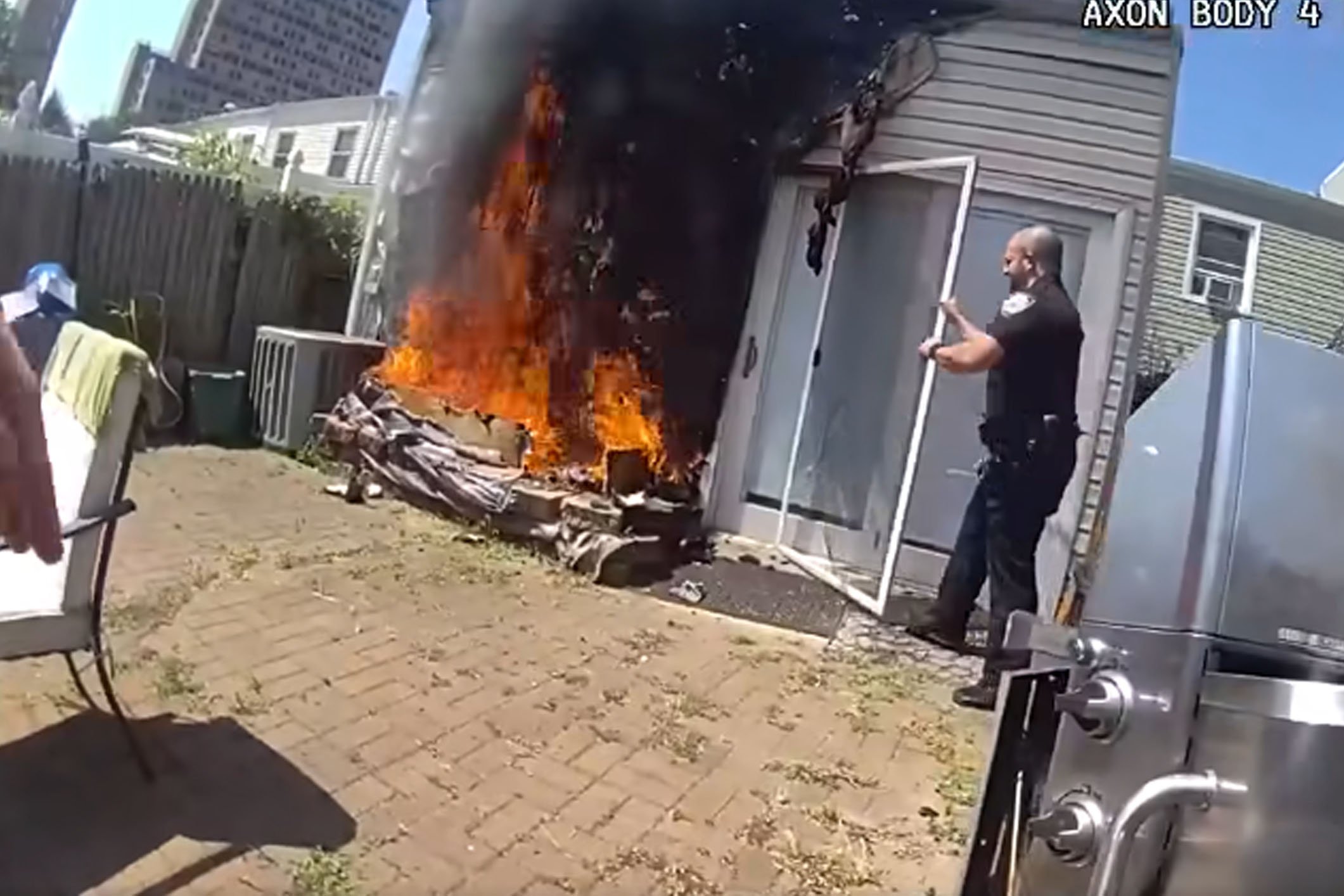 Coney Island cops rush into burning home to save family and dog during daylight patrol
