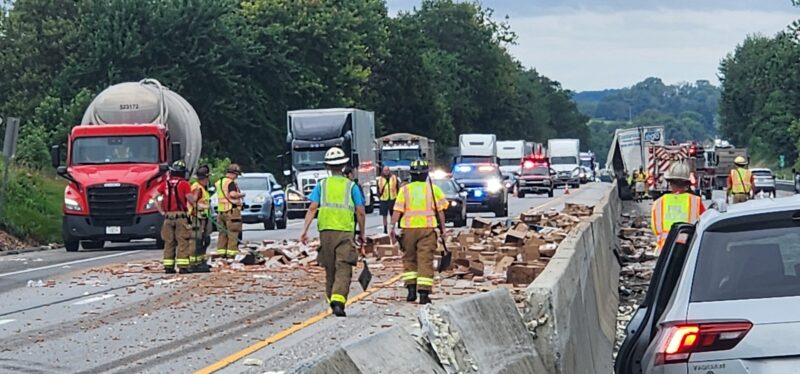 Tractor-trailer crash spills 1,000 pounds of hot dogs on highway, injuring four people