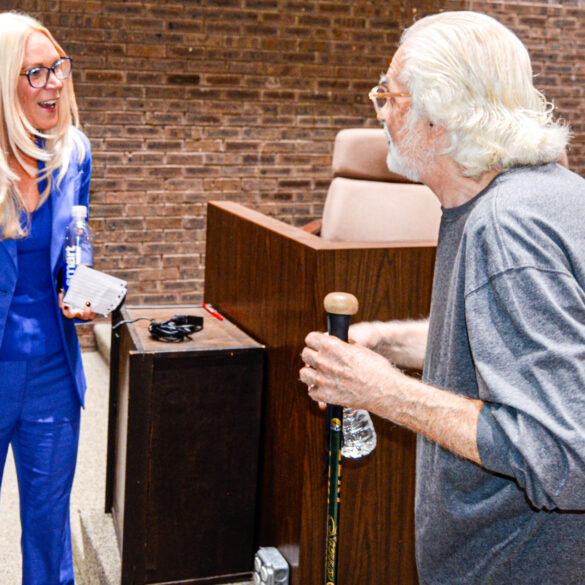 Mayor jennifer kuhn meets with a resident after this week's jackson township council meeting.