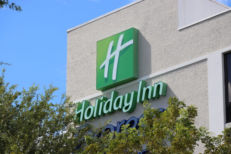 Holiday Inn sign against blue sky