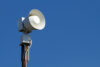 Loudspeaker mounted on utility pole.