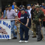 Veterans marching with pride and honor.