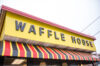 Bright yellow waffle house sign