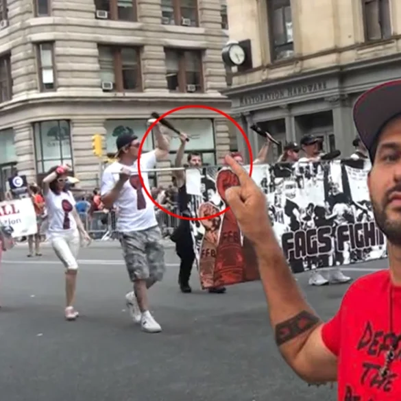 Chris pollak - marching in the nyc pride parade with a shirt some say could say "defund the police"