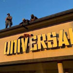 Ms-13 fugitive gets trapped on storefront billboard sign in failed escape from ice - photo licensed by shore news network.