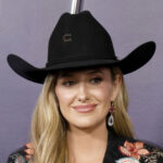 Lainey Wilson claimed the show’s highest honor, winning CMA Entertainer of the Year, and tied with Riley Green and Ella Langley for the most trophies of the night, each taking home three.