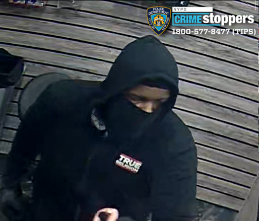 Armed robbers assault employee and flee in gray mercedes suv after daytime heist