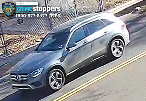 Armed robbers assault employee and flee in gray mercedes suv after daytime heist