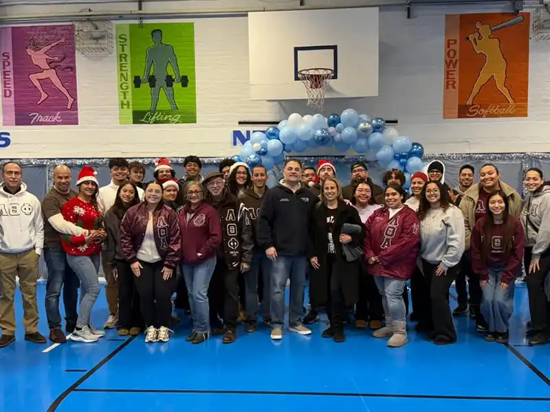 Paterson officers and lambda fraternity spread holiday cheer at annual christmas event - photo licensed by shore news network.