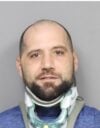 Utica man charged after threatening to return to hospital with gun