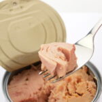 Canned tuna recalled after distributor mistakenly ships quarantined cans tied to botulism risk - photo licensed by shore news network.