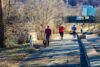 Early morning walkers, runners, joggers and dog walker on the roanoke river greenway