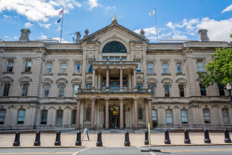 Exterior view of New Jersey State House building in Trenton, NJ. The New Jersey State House is located on the W. State Street in downtown Trenton. The Capitol is the most historic public building in New Jersey, comprised of the State Legislature, the Governor`s Office and other Executive branch offices.