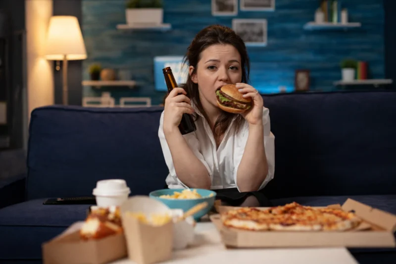 Single woman eating a hamburger - photoshop/generated/satire