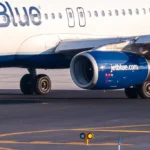 Engine issue forces emergency landing at newark airport; passengers use slide to exit plane - photo licensed by shore news network.