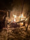 Fire engulfs backyard kennel as crews rescue two dogs in manchester