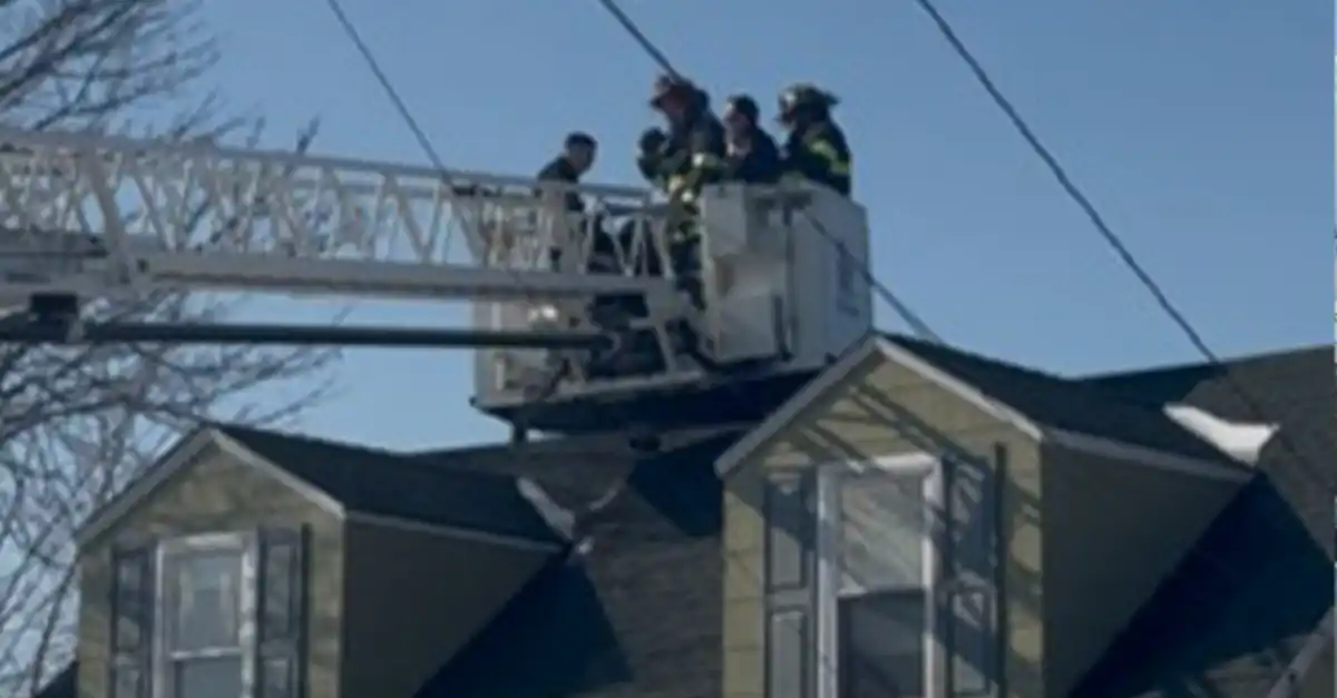 Ladder truck called to bring down boy stuck on mastic beach roof - photo licensed by shore news network.