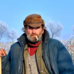 Man smoking in a field