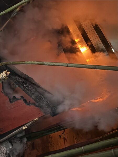 Fire engulfs backyard kennel as crews rescue two dogs in Manchester