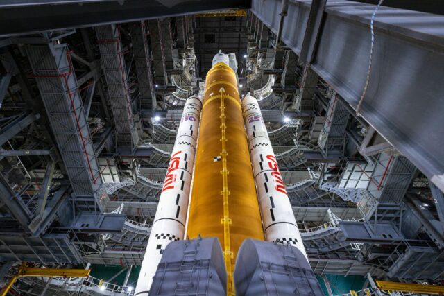 All work platforms are retracted from around nasa’s artemis ii sls (space launch system) rocket and orion spacecraft, secured to the mobile launcher, inside the vehicle assembly building on thursday, march 19, 2026, in preparation for rollout to launch complex 39b at nasa’s kennedy space center in florida.   nasa/frank michaux