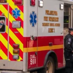 Two Philadelphia Transit Policeman are seen by a Philadelphia Fire Department Emergency Medical Services ambulance on a city street