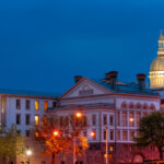 Illuminated NJ state capitol complex with golden dome at night in Trenton, New Jersey, USA