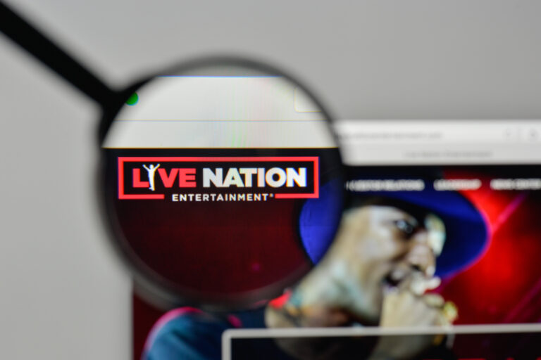 Magnifying glass focusing on the Live Nation Entertainment logo on a computer screen.