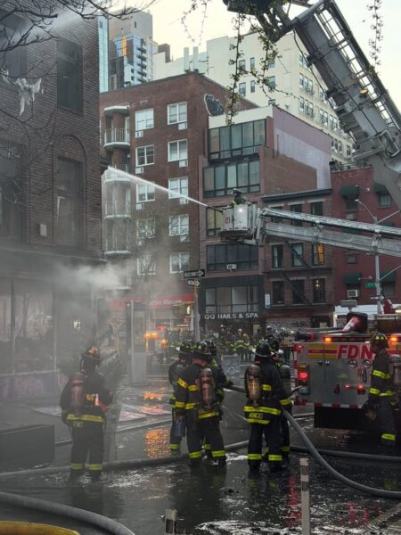 Two firefighters were injured as crews battled a three-alarm fire in a vacant manhattan building early sunday Two firefighters were injured as crews battled a three-alarm fire in a vacant manhattan building early sunday