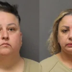 Two front-facing mugshots side by side of a woman in a beige top against a gray background, one with dark hair and one with blonde hair.