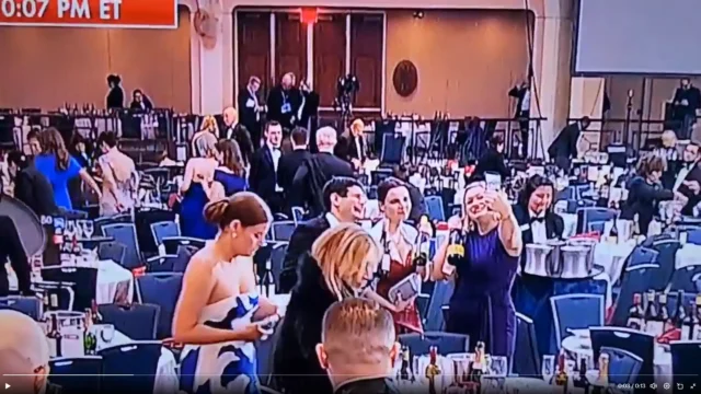 Video shows members of the press snagging bottles of wine from tables after shooting at correspondents dinner