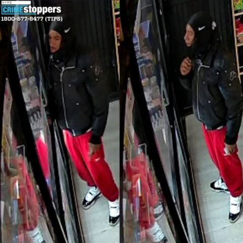 Surveillance image of a man in a black hooded jacket and red pants inside a store; crime stoppers logo in the corner.