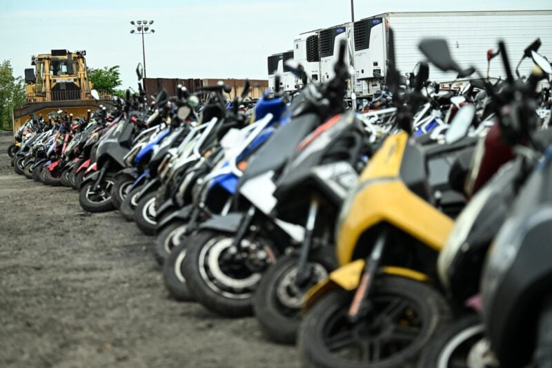 Green-touting nyc crushes and dumps thousands of "dangerous" mopeds confiscated in citywide push