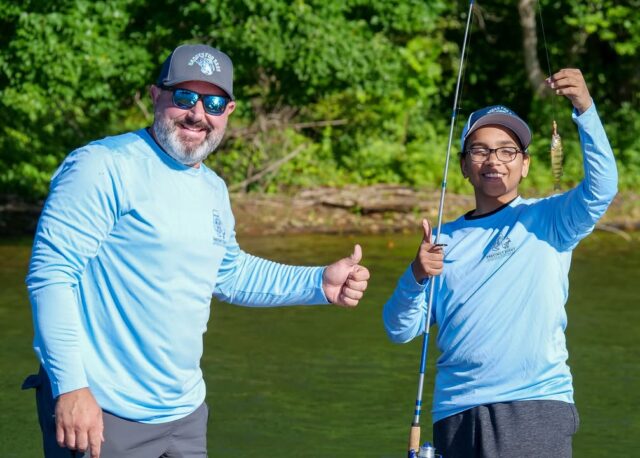 Cops and kids hit the water as baltimore county's badges for bass reels in community bonds