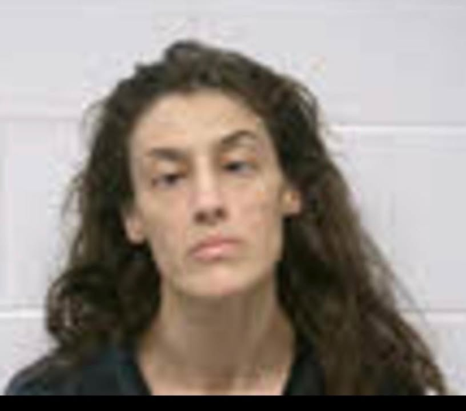 Woman hiding in tree line busted with meth in macon county