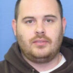 Gunman in blue hoodie still sought a decade after clerk was gunned down at work