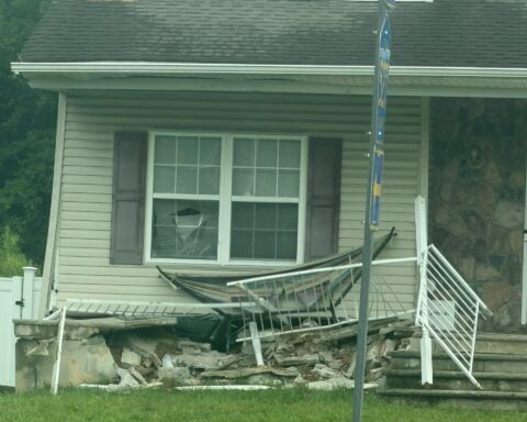 A coach bus traveling northbound crashed into a home at the busy T-intersection of East Veterans Highway (Ocean County Route 528) and Whitesville Road early Wednesday morning after apparently continuing straight through the intersection.