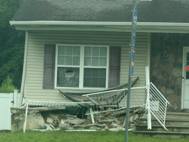 A coach bus traveling northbound crashed into a home at the busy T-intersection of East Veterans Highway (Ocean County Route 528) and Whitesville Road early Wednesday morning after apparently continuing straight through the intersection.