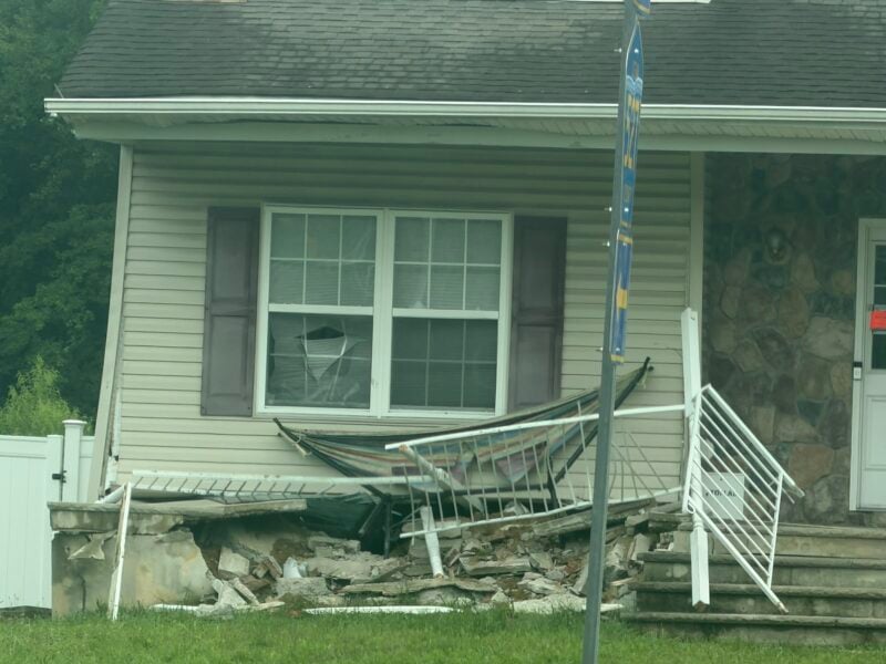 A coach bus traveling northbound crashed into a home at the busy T-intersection of East Veterans Highway (Ocean County Route 528) and Whitesville Road early Wednesday morning after apparently continuing straight through the intersection.