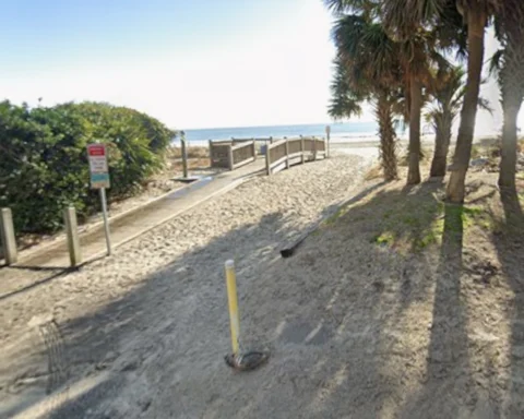 Emergency crews recovered the body of a swimmer who disappeared after rescuing a young girl from a rip current off Myrtle Beach.
