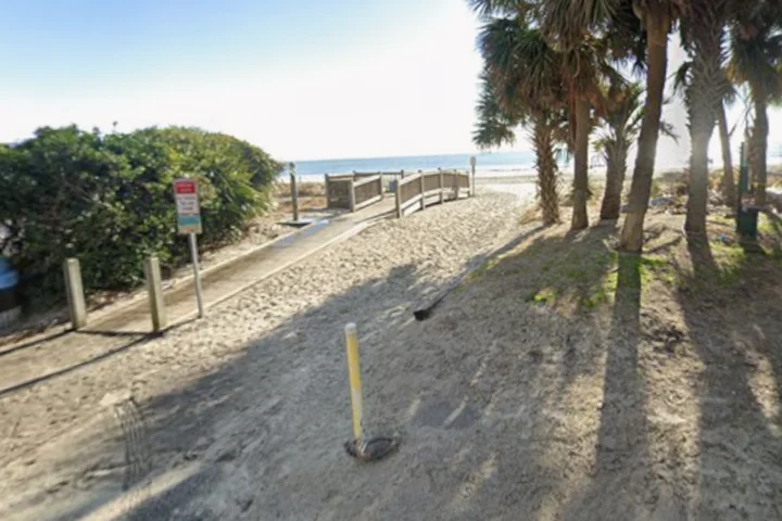 Emergency crews recovered the body of a swimmer who disappeared after rescuing a young girl from a rip current off Myrtle Beach.