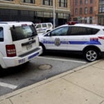 Baltimore,Maryland police vehicles. City police cars outside Baltimore police headquaters - by Kevin Duke
