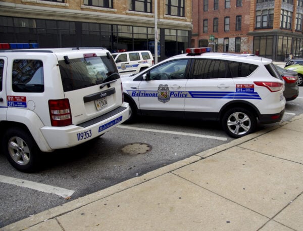 Baltimore,Maryland police vehicles. City police cars outside Baltimore police headquaters - by Kevin Duke