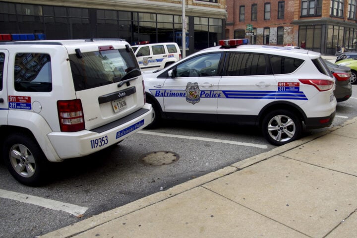 Baltimore,Maryland police vehicles. City police cars outside Baltimore police headquaters - by Kevin Duke